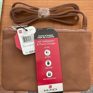 Brand NEW in original packaging Mundi crossbody travel purse.